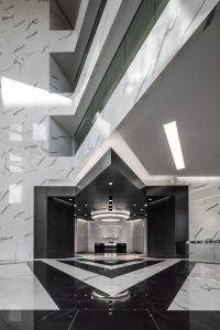 Architecture Building Repositioning Corporate Interior Design 1415 Louisiana Houston Circular Lighting Entrance Lobby Black and White