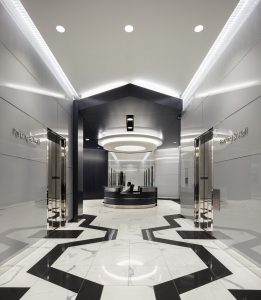 Architecture Building Repositioning Corporate Interior Design 1415 Louisiana Houston Circular Lighting Entrance Lobby Black and White Geometric Floors