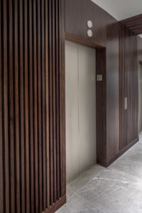 HighPoint Resources Corporate Interior Design Elevator Lobby Wood Wall Floor Tile