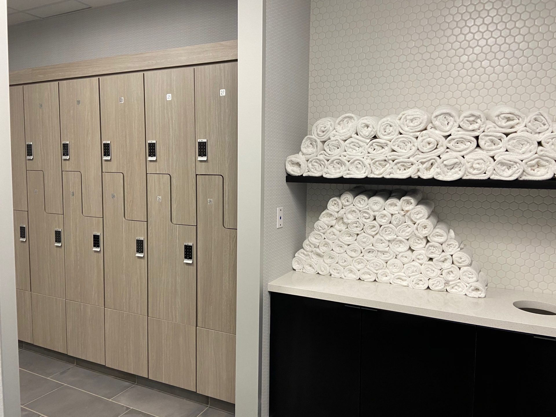 Houston Architecture Building Repositioning 1415 LOUISIANA FITNESS CENTER Houston Corporate Interior Design Locker Room Towels Storage