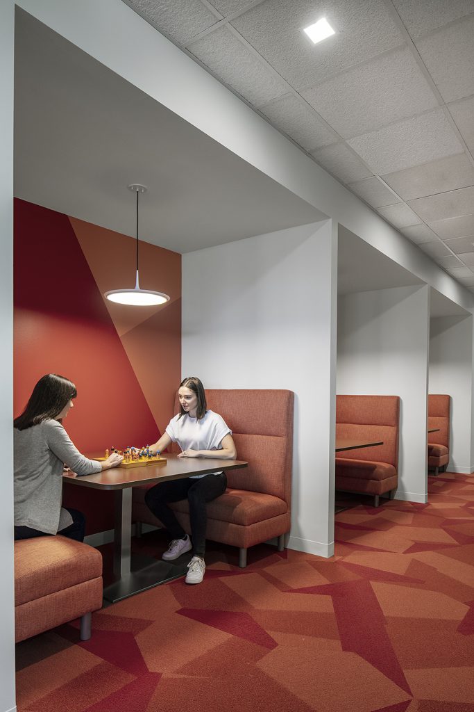 CERITY Corporate Insurance Design Break Room Booth Seating with people